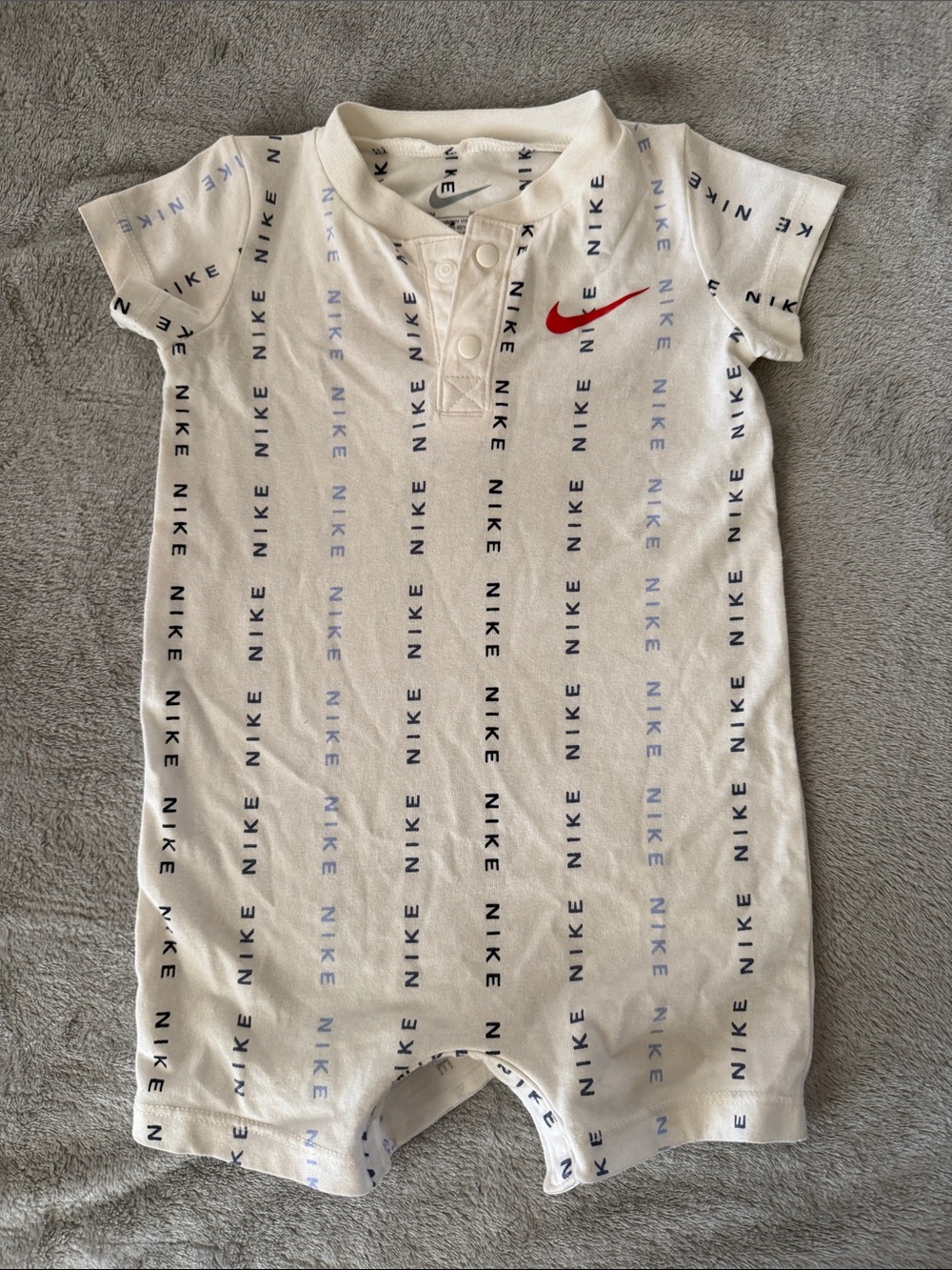 Nike White Infant Romper with Red Swoosh and Blue Logo Stripes